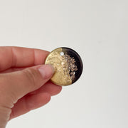 Tag rond goud met zwart