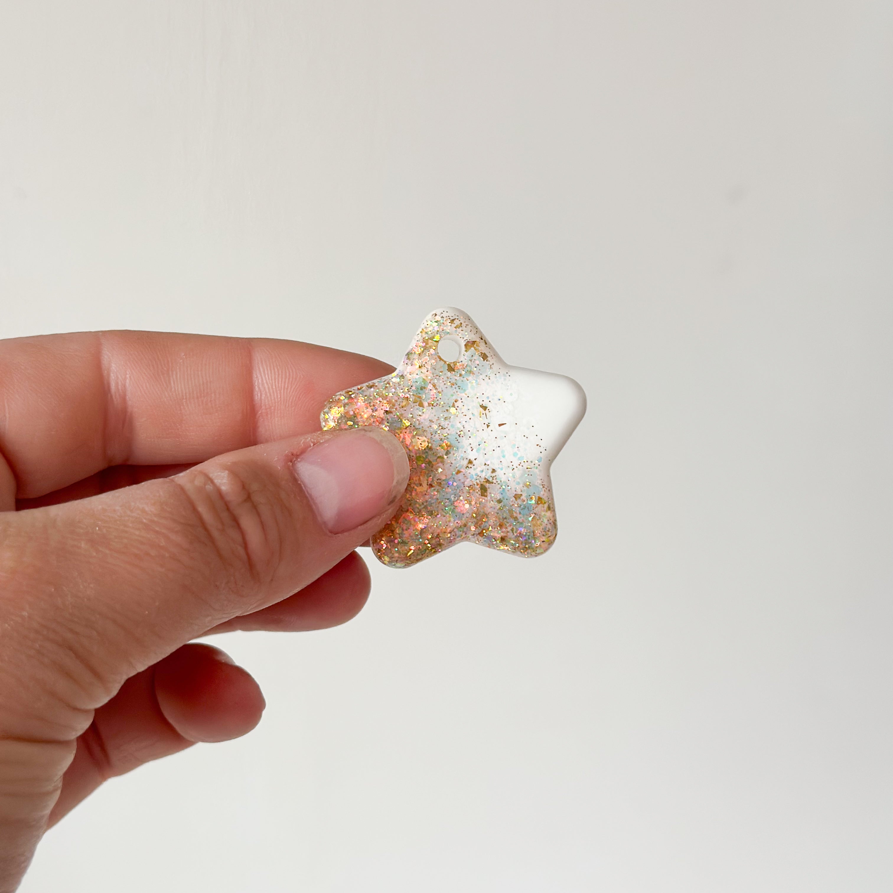 Tag ster wit met goude glitter