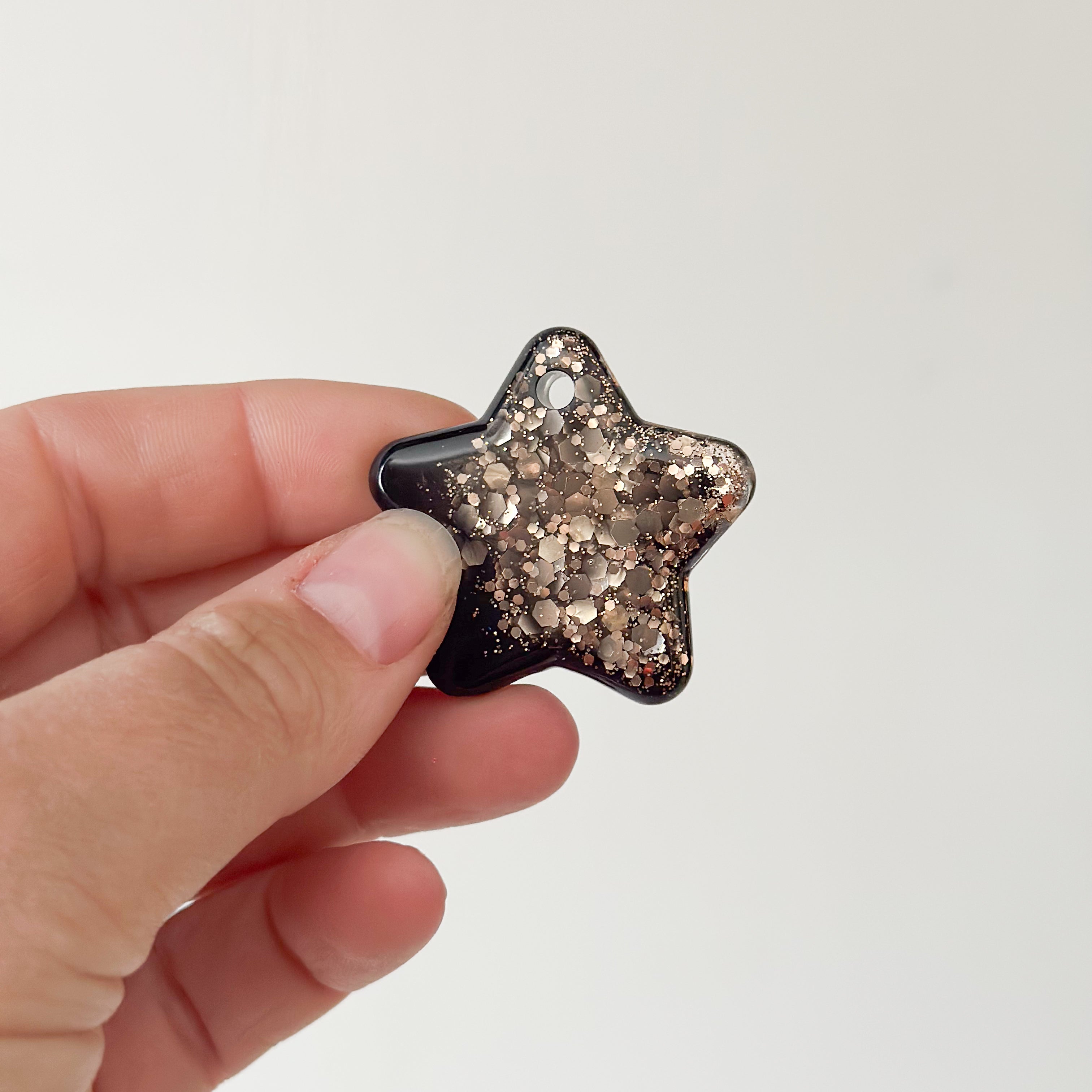 Tag ster zwart met bronze glitters