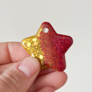 Tag ster goud met rode glitter