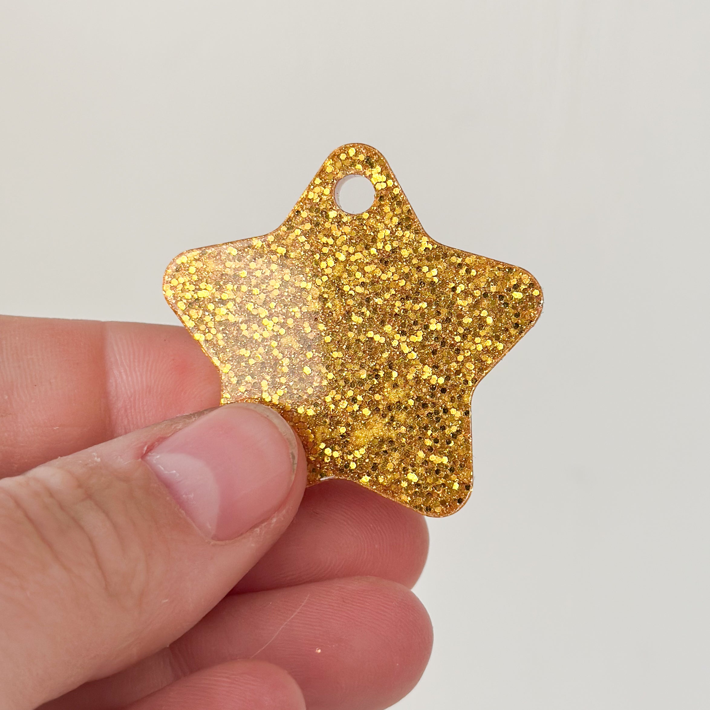 Tag ster goude glitter